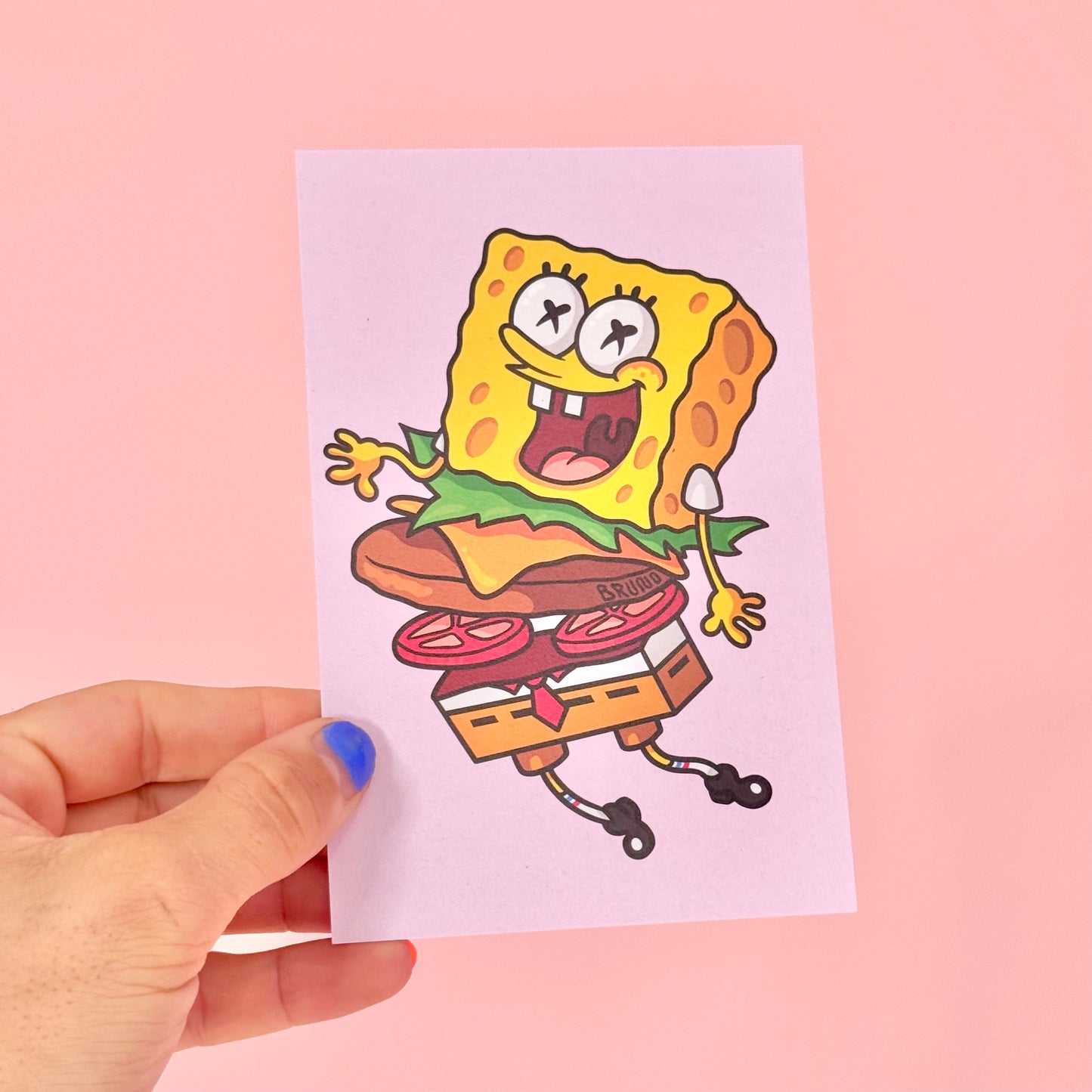 Carte postale Bob l’Éponge Burger -Carte postale imprimée d’une illustration digitale.Imprimée sur un papier 300g recyclé. Possibilité de la faire signer et dédicacer à la main en choisissant l'option de livraison "Dédicacée".-Brunograffer Carte postale Bob l’Éponge Burger -Carte postale imprimée d’une illustration digitale.Imprimée sur un papier 300g recyclé. Possibilité de la faire signer et dédicacer à la main en choisissant l'option de livraison