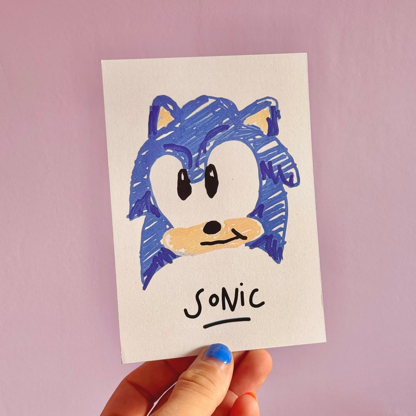 Carte postale Sonic -Carte postale imprimée d’un concept de dessins dans lequel je fais prendre vie à un personnage de dessin animé via sa peluche pour lui faire faire dessiner son autoportrait.Imprimée sur un papier 300g recyclé. Possibilité de la faire signer et dédicacer à la main en choisissant l'option de livraison "Dédicacée".-Brunograffer Carte postale Sonic -Carte postale imprimée d’un concept de dessins dans lequel je fais prendre vie à un personnage de dessin animé via sa peluche pour lui faire faire dessiner son autoportrait.Imprimée sur un papier 300g recyclé. Possibilité de la faire signer et dédicacer à la main en choisissant l'option de livraison