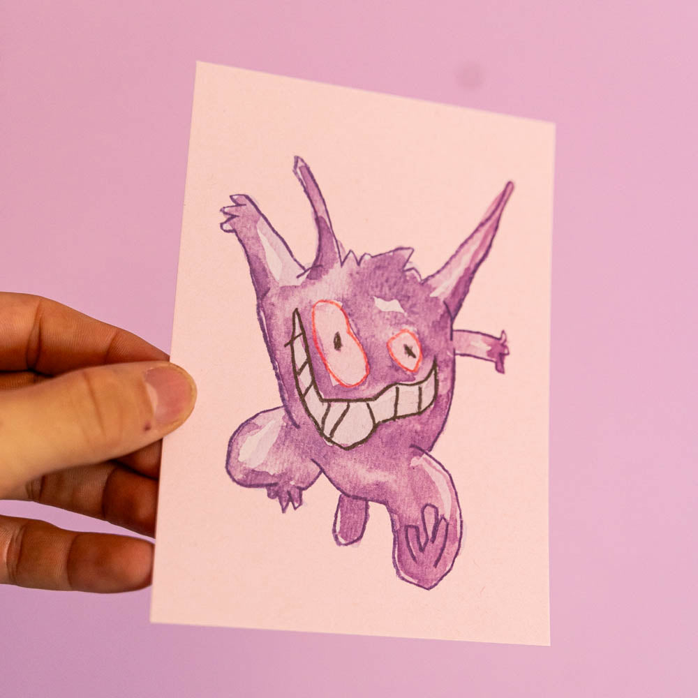 Carte postale Ectoplasma (Edition Moche) -Carte postale imprimée d’une illustration réalisée à l'aquarelle et aux crayons de couleurs.Le dessin vient d'un challenge en live sur Twitch dans lequel j'ai dessiné les 151 Pokémon de la première génération de 1995 en 24h en live sur Twitch, MAIS : en moche ! Voir la vidéo : https://youtu.be/0MyLD5bqc1Q Papier 300g recyclé. Possibilité de la faire signer et dédicacer à la main en choisissant l'option de livraison 