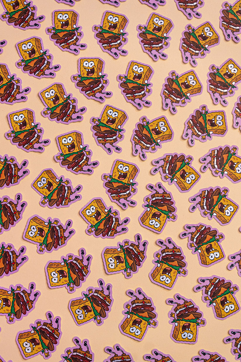 Bob l'Éponge Burger -Illustration digitale imprimée sur stickers Vinyl mat avec effet holographique. Les autocollants sont résistant aux poussières et aux éclaboussures. Veillez bien à les coller sur une surface lisse, propre et sèche pour un bon maintient. Par exemple sur un casque, un vélo, un frigo, une porte, le dos d'un téléphone, etc. Matériaux : Sticker Vinyle mat avec effet holographique.Dimensions : 4,3 x 5,8 cm Vendu à l'unité-Brunograffer